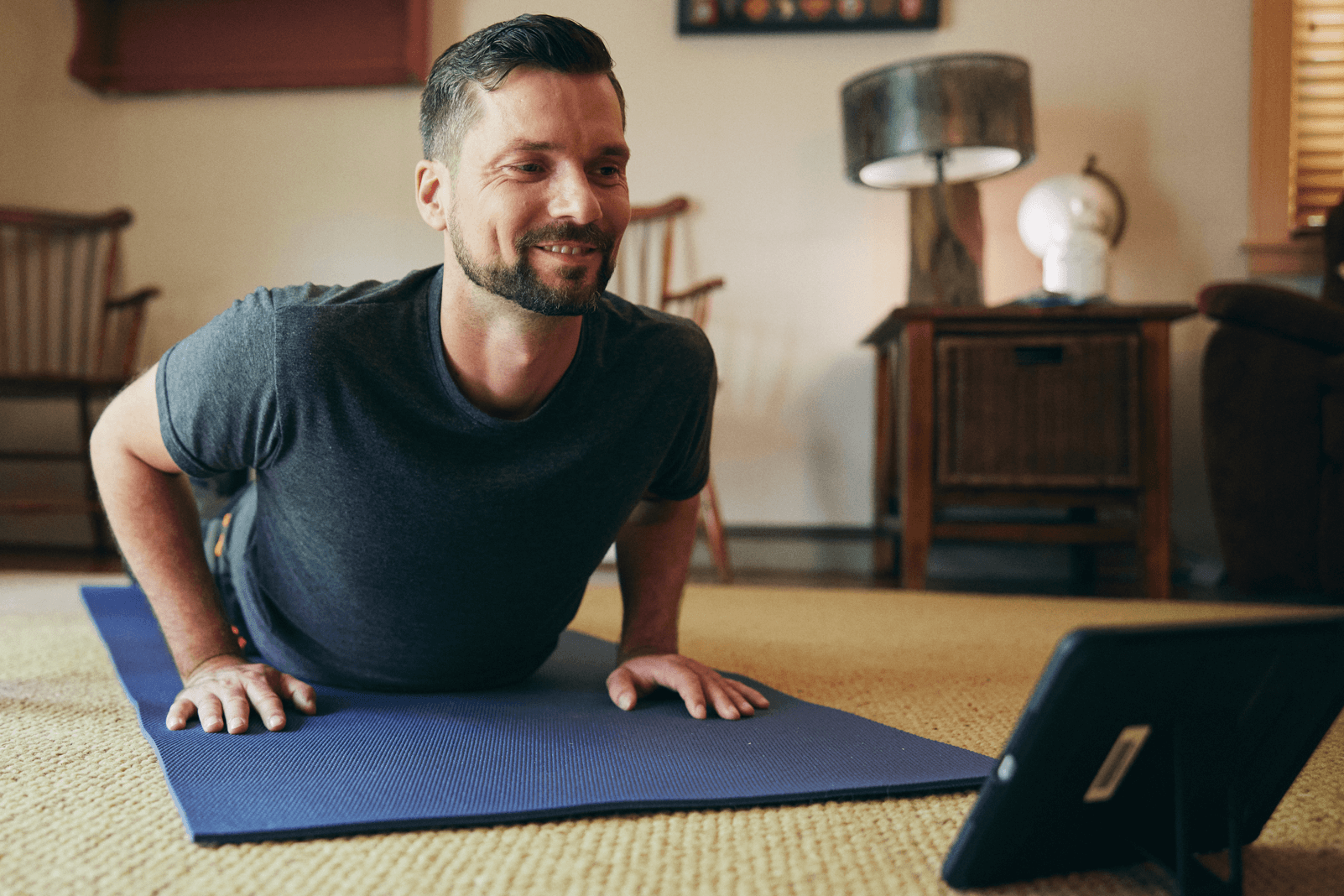 Veteran using his tablet during a physical therapy session