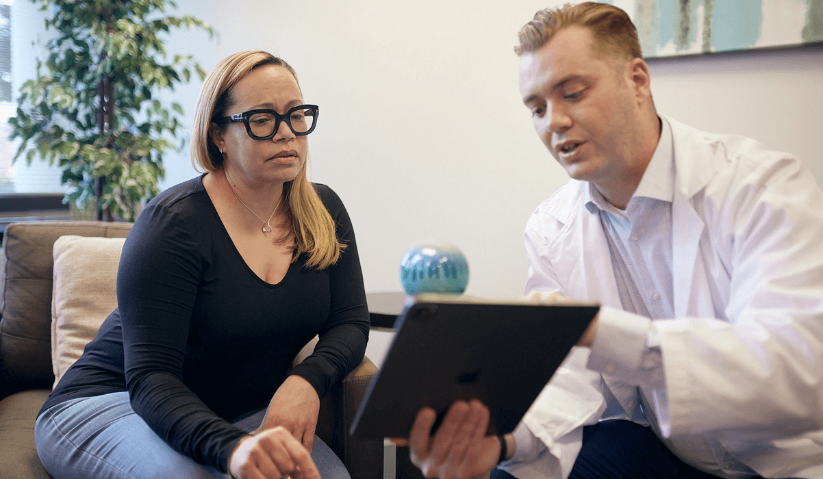 Woman Veteran using tablet with healthcare provider