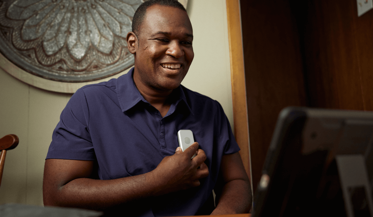 An African American man using a tablet device for Telehealth